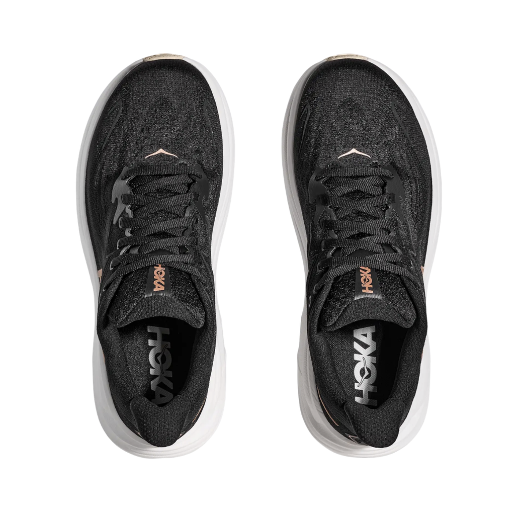 Top view of the HOKA Women’s Clifton 10 in Black/Rose Gold, showing the molded EVA sockliner, padded tongue, and double-lace lock system for secure, cushioned all-day comfort.