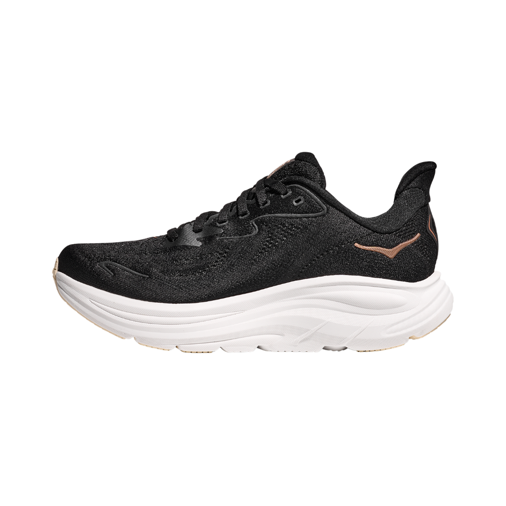 Side view of the HOKA Women’s Clifton 10 in Black/Rose Gold, showcasing the lightweight jacquard knit upper, plush CMEVA midsole cushioning, and smooth MetaRocker™ geometry for a soft, efficient ride.
