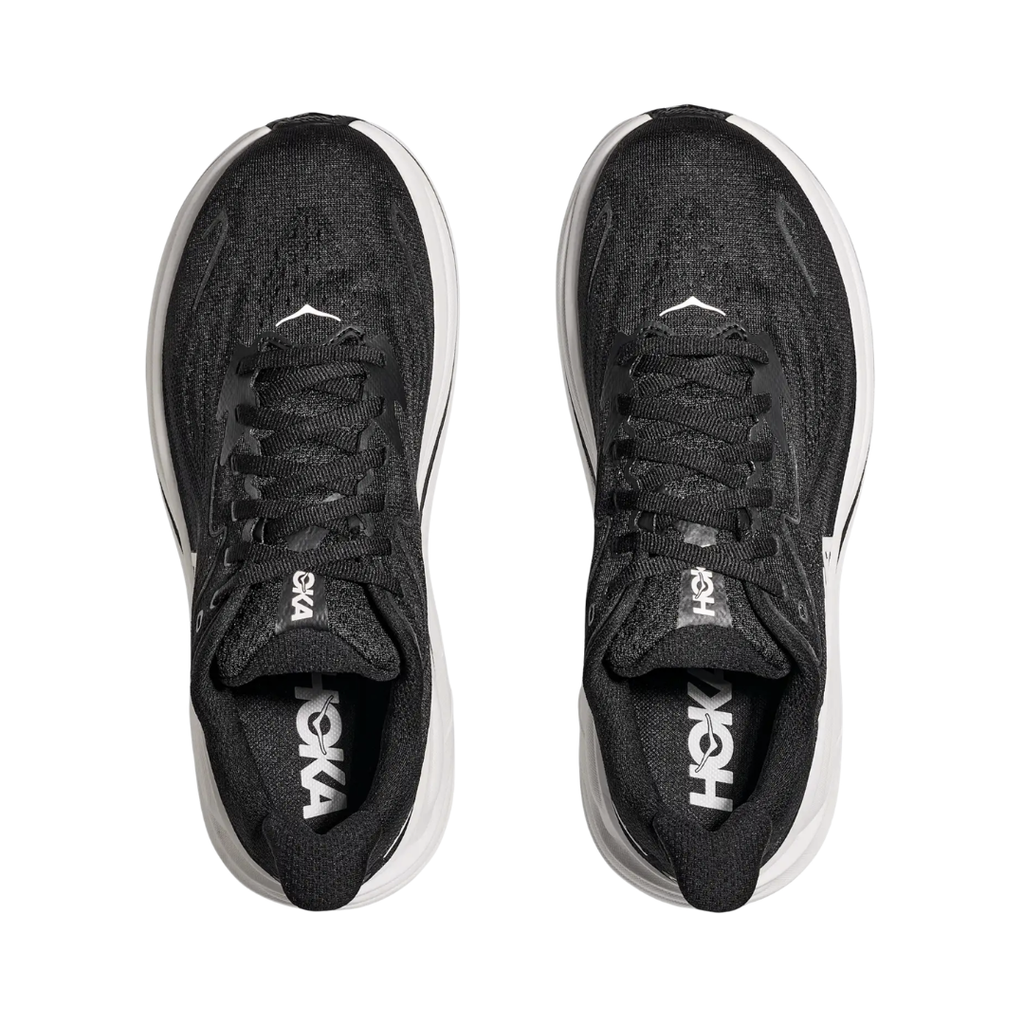 Top view of the HOKA Women’s Clifton 10 in Black/White, showing the molded EVA sockliner, padded tongue, and double-lace lock system for secure, cushioned all-day comfort.