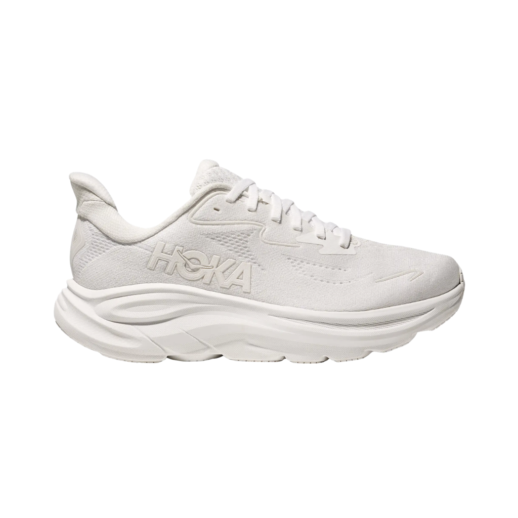 Side view of the HOKA Women’s Clifton 10 in White/White, showcasing the lightweight jacquard knit upper, plush CMEVA midsole cushioning, and smooth MetaRocker™ geometry for a soft, efficient ride.