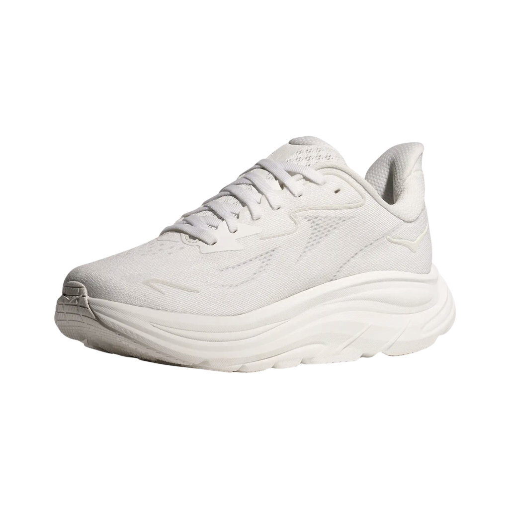 Side view of the HOKA Women’s Clifton 10 in White/White, showcasing the lightweight jacquard knit upper, plush CMEVA midsole cushioning, and smooth MetaRocker™ geometry for a soft, efficient ride.