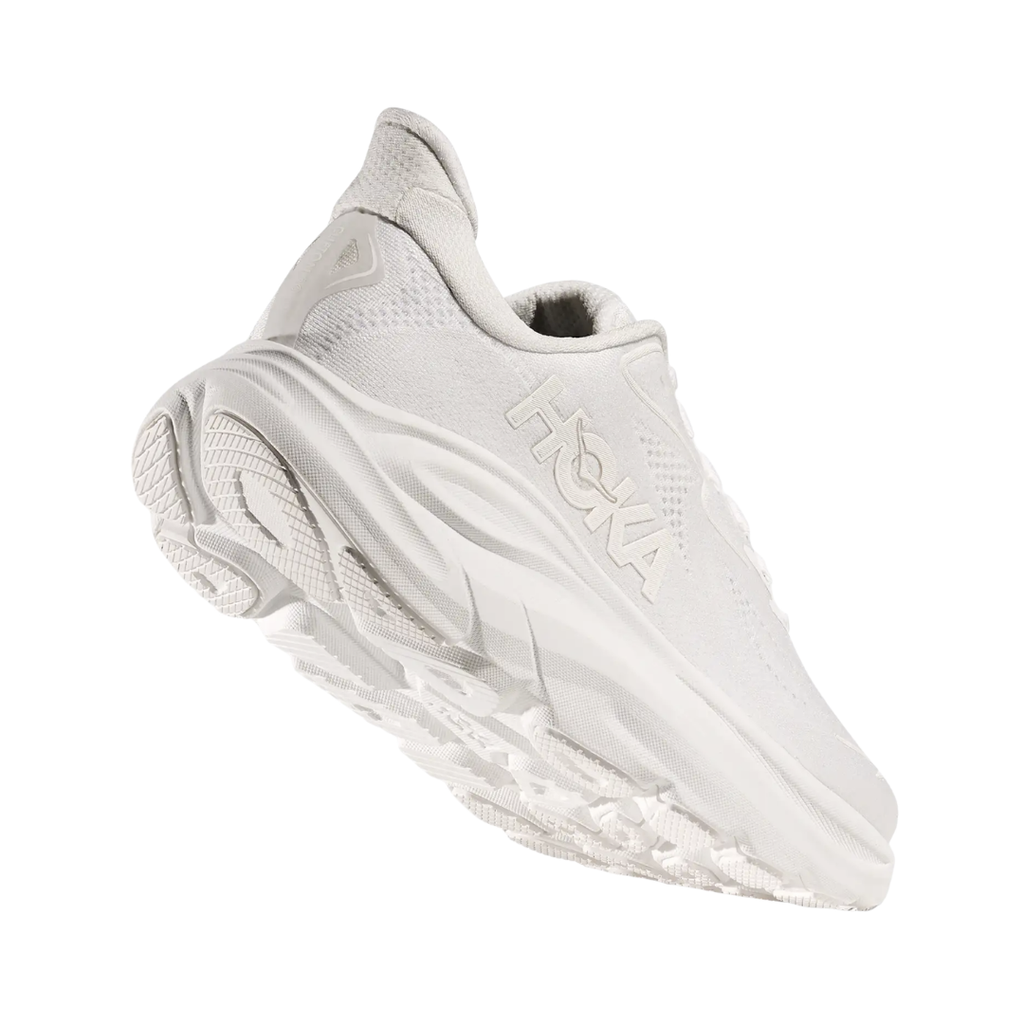 Bottom heel view of the HOKA Women’s Clifton 10 in White/White, highlighting the durable outsole with traction zones designed for reliable grip and long-lasting performance.
