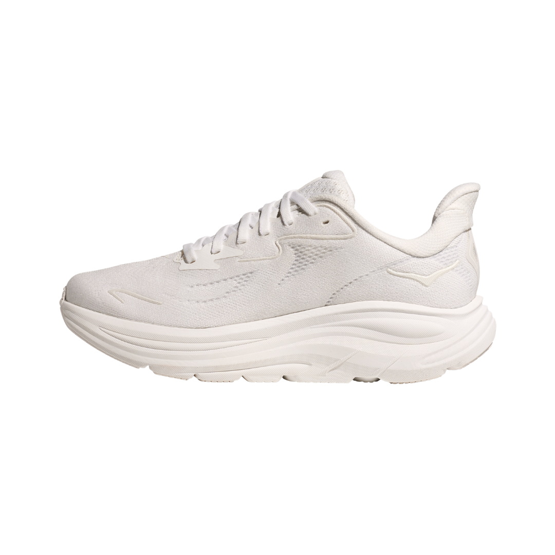 Side view of the HOKA Women’s Clifton 10 in White/White, showcasing the lightweight jacquard knit upper, plush CMEVA midsole cushioning, and smooth MetaRocker™ geometry for a soft, efficient ride.