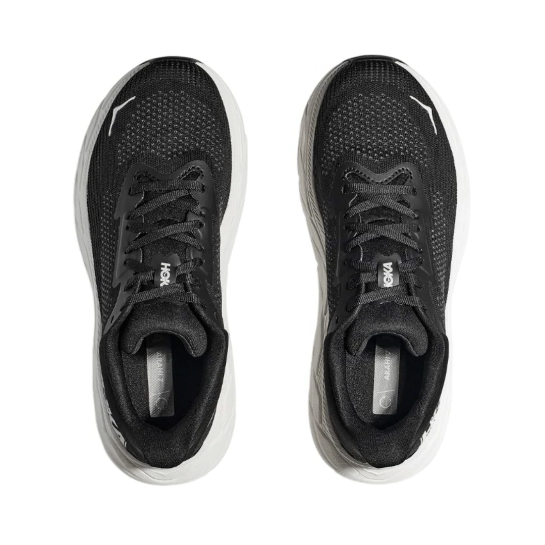 Top view of the Women's HOKA Arahi 7 in Black/White displaying the Creel Jacquard mesh upper, secure lacing system, padded tongue and heel collar, and removable insole designed to accommodate custom or over-the-counter orthotics.