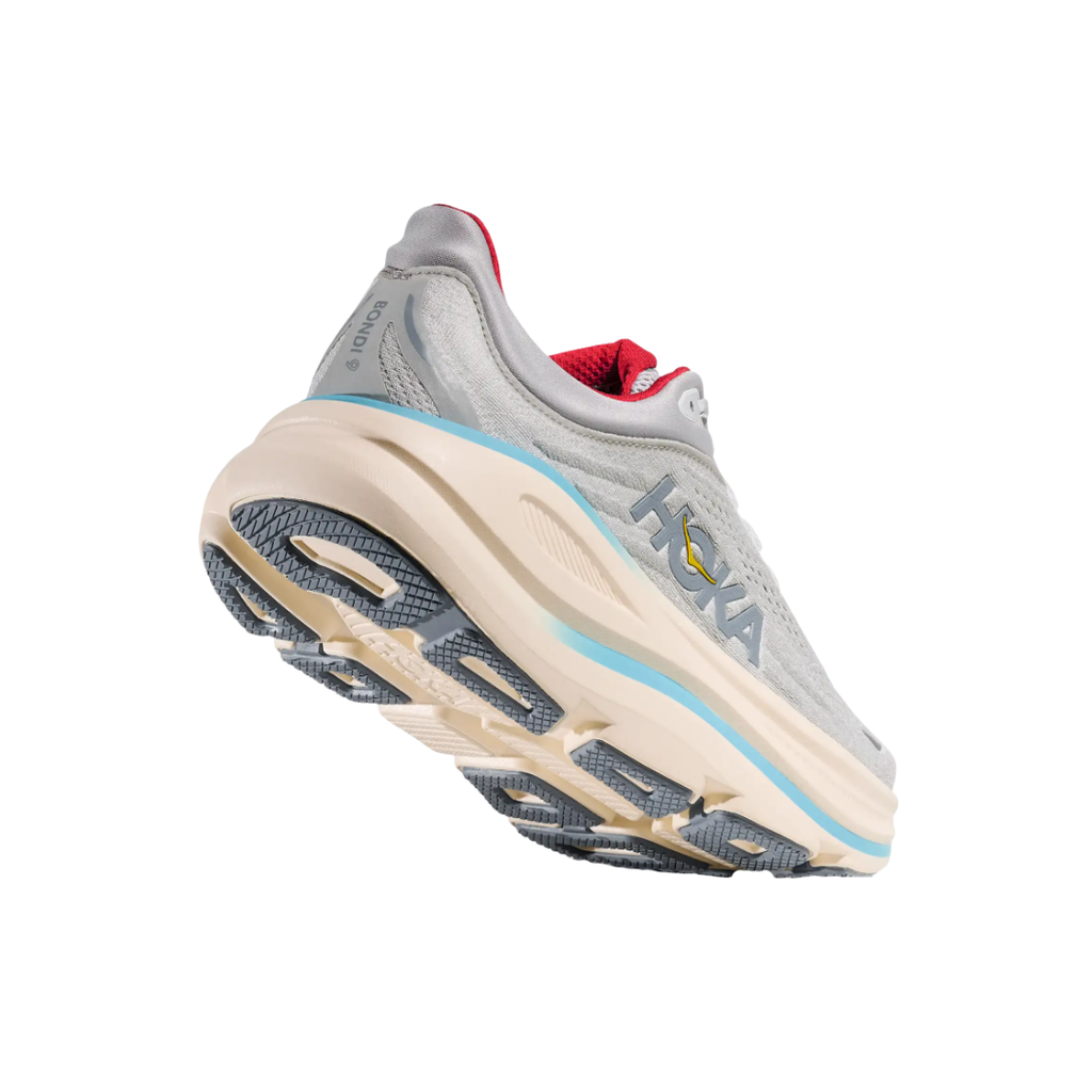 Bottom view of the HOKA Women’s Bondi 9 in Cosmic Grey/Stardust, highlighting the Durabrasion rubber outsole with high-wear traction zones for durability and reliable grip.