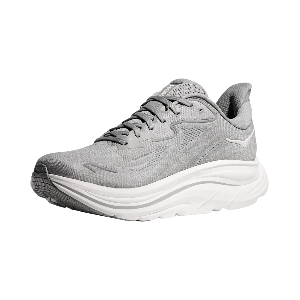 Side view of the HOKA Women’s Clifton 10 in Stellar Grey/Galactic Grey, showcasing the lightweight jacquard knit upper, plush CMEVA midsole cushioning, and smooth MetaRocker™ geometry for a soft, efficient ride.