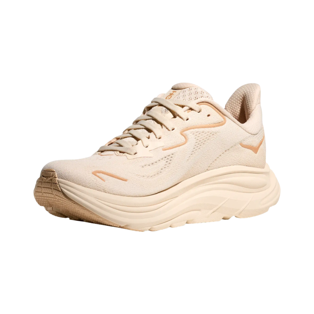 Side view of the HOKA Women’s Clifton 10 in Vanilla/Birch, showcasing the lightweight jacquard knit upper, plush CMEVA midsole cushioning, and smooth MetaRocker™ geometry for a soft, efficient ride.