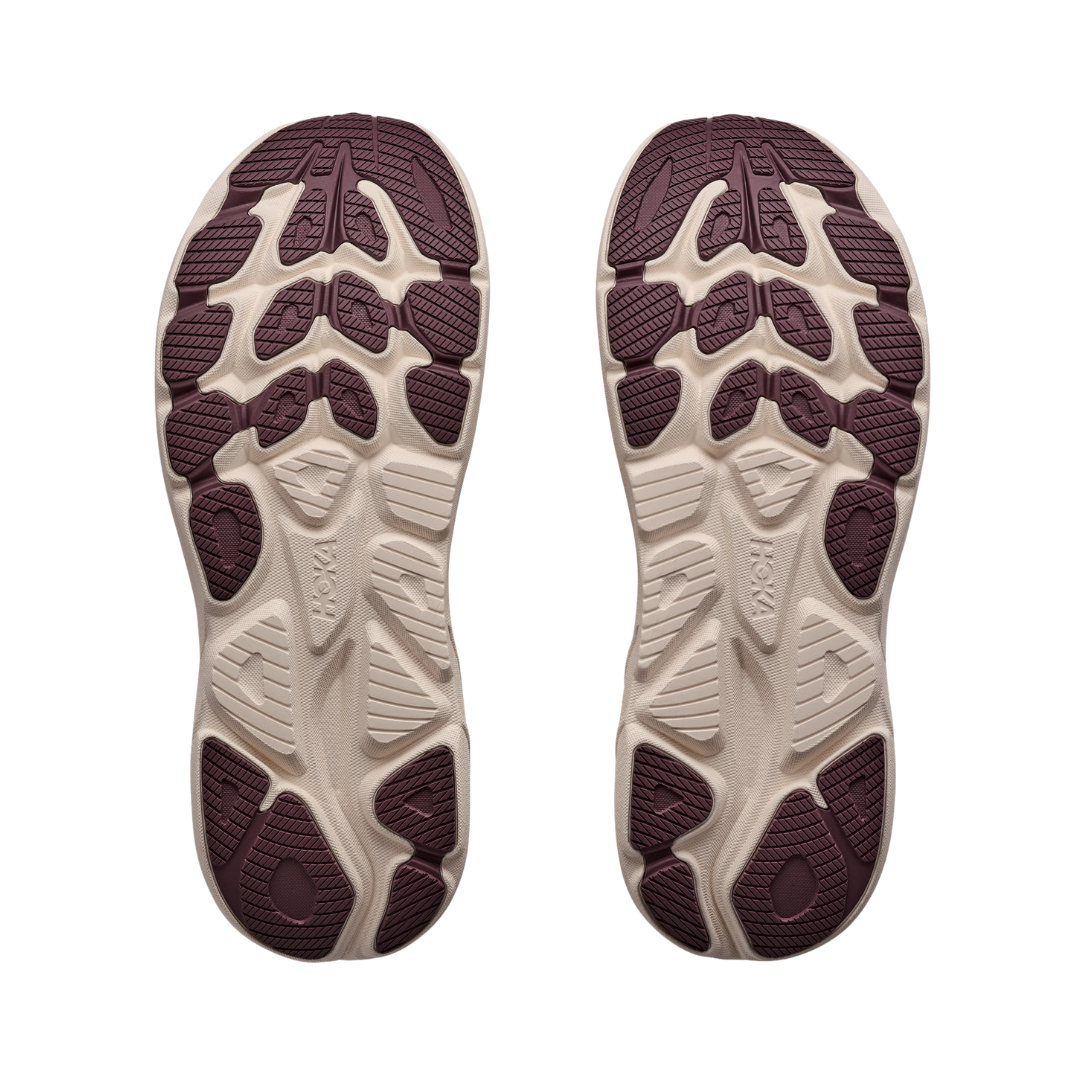 Bottom view of the Men's Hoka Clifton 11 in Barley Flour/Barley, featuring the abrasion-resistant rubber outsole with strategically placed rubber for reliable traction and durability in high-wear areas.