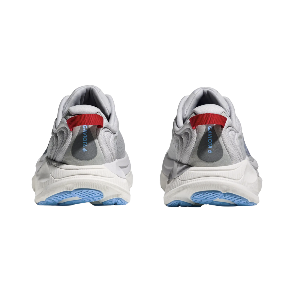 Heel view of the Women’s HOKA Gaviota 6 in Cosmic Grey/Stardust, highlighting the padded comfort collar, heel pull webbing, and structured rearfoot support for added stability and easy on/off.
