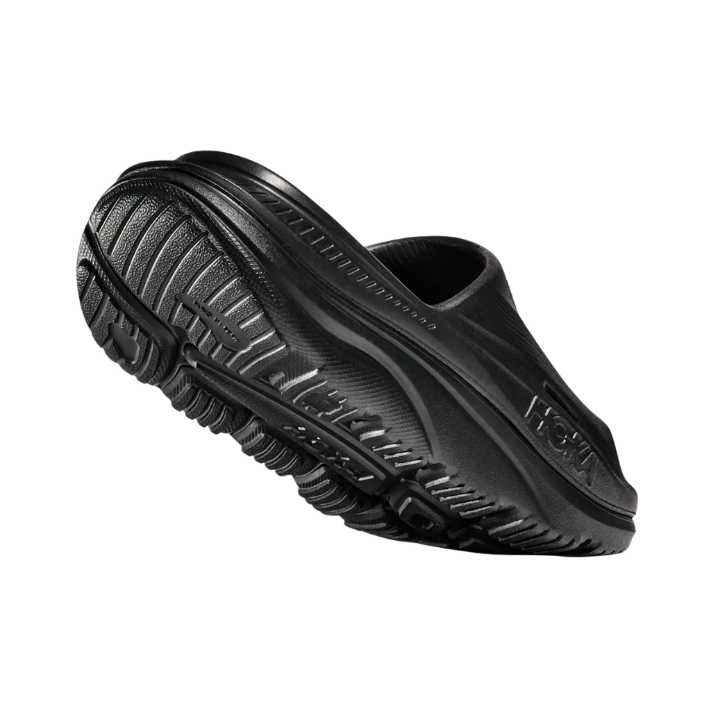 Rear view of the Unisex HOKA Ora Recovery Slide 3 in Black highlighting the refined heel shape, cushioned heel area, supportive EVA construction, and lightweight design for a comfortable, secure fit.