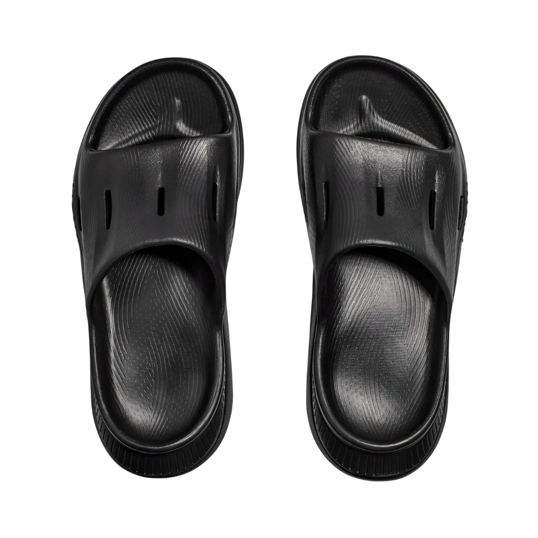 Top view of the Unisex HOKA Ora Recovery Slide 3 in Black displaying the ventilated upper, spacious forefoot, contoured footbed, and easy slip-on design for breathable comfort around the house, gym, or after exercise.