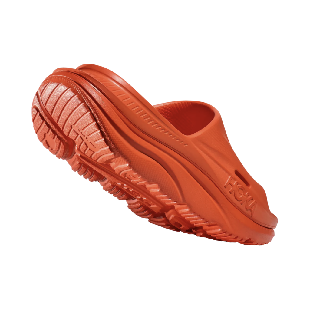 Rear view of the Unisex HOKA Ora Recovery Slide 3 in Orange highlighting the refined heel shape, cushioned heel area, supportive EVA construction, and lightweight design for a comfortable, secure fit.