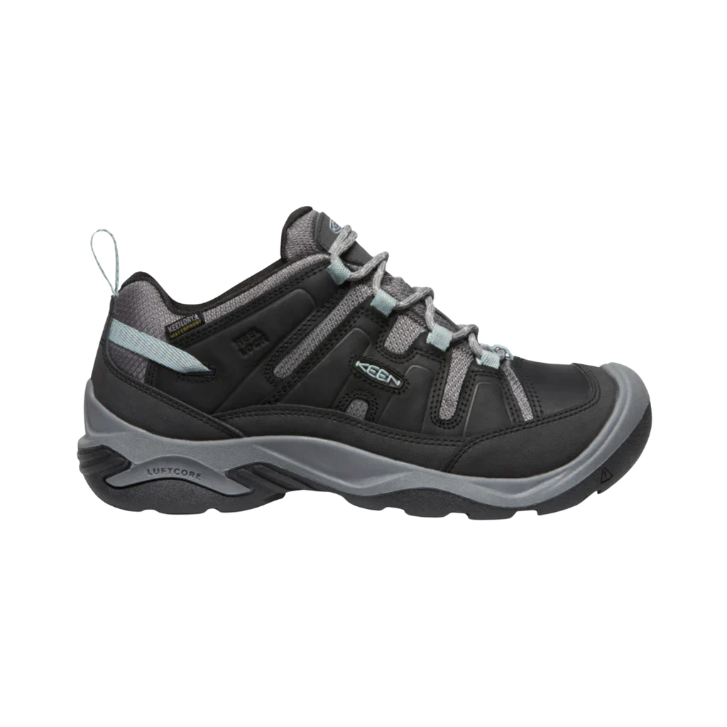 KEEN Women's Circadia Low Waterproof Hiking Shoe in Black/Cloud Blue featuring a durable upper, KEEN.DRY waterproof protection, cushioned EVA midsole, and high-traction rubber outsole.