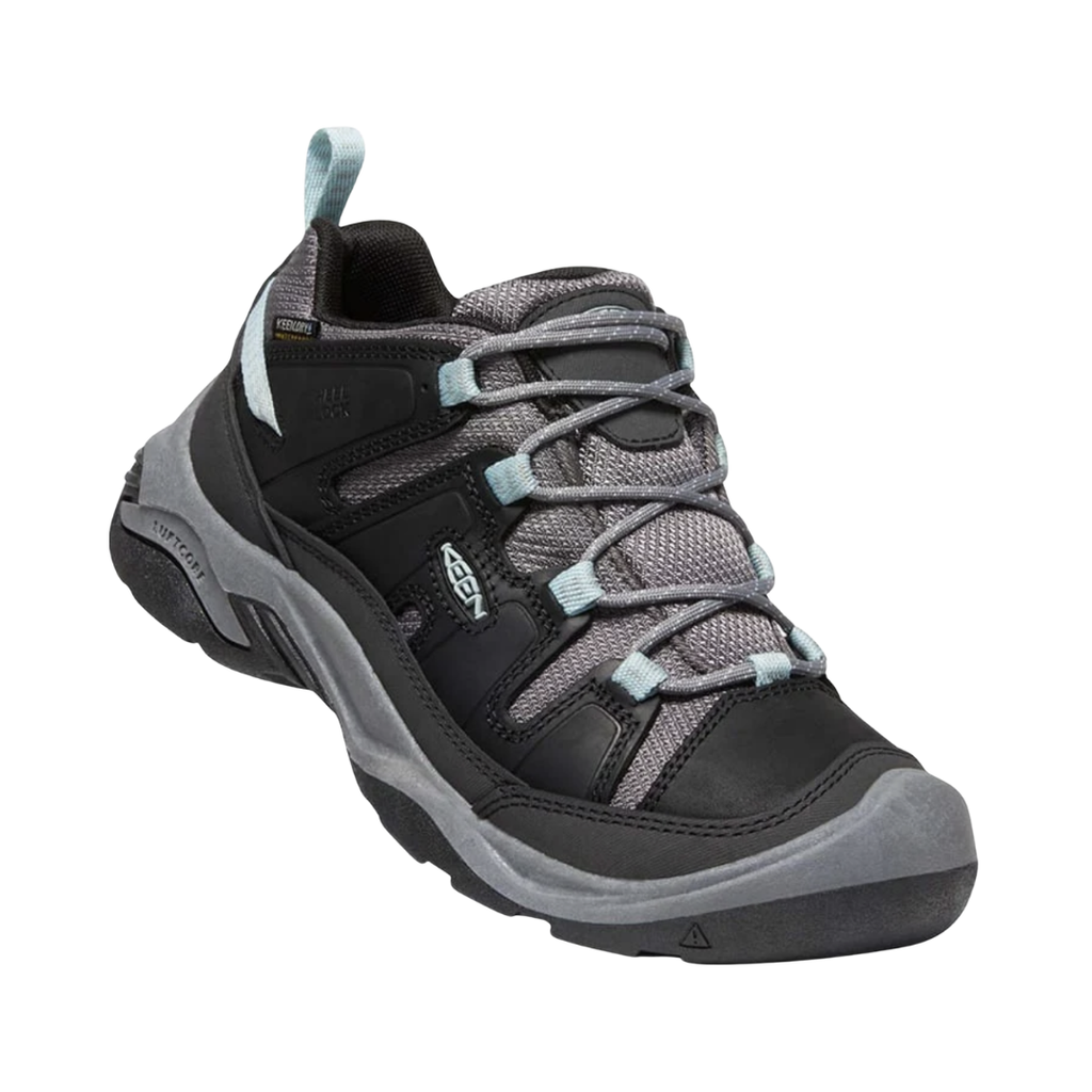 KEEN Women's Circadia Low Waterproof Hiking Shoe in Black/Cloud Blue featuring a durable upper, KEEN.DRY waterproof protection, cushioned EVA midsole, and high-traction rubber outsole.