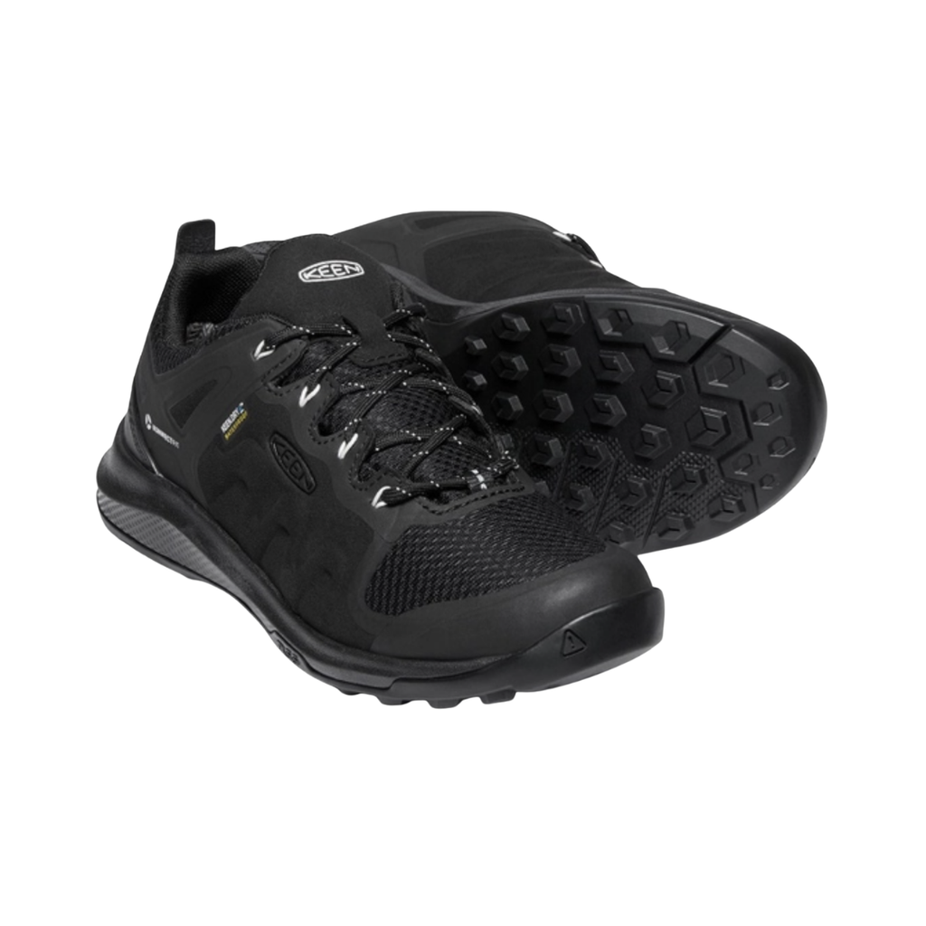KEEN Women's Explore Waterproof Hiker in Black/Star White featuring a performance mesh upper with TPU overlays, waterproof construction, cushioned EVA midsole, and rugged rubber outsole.