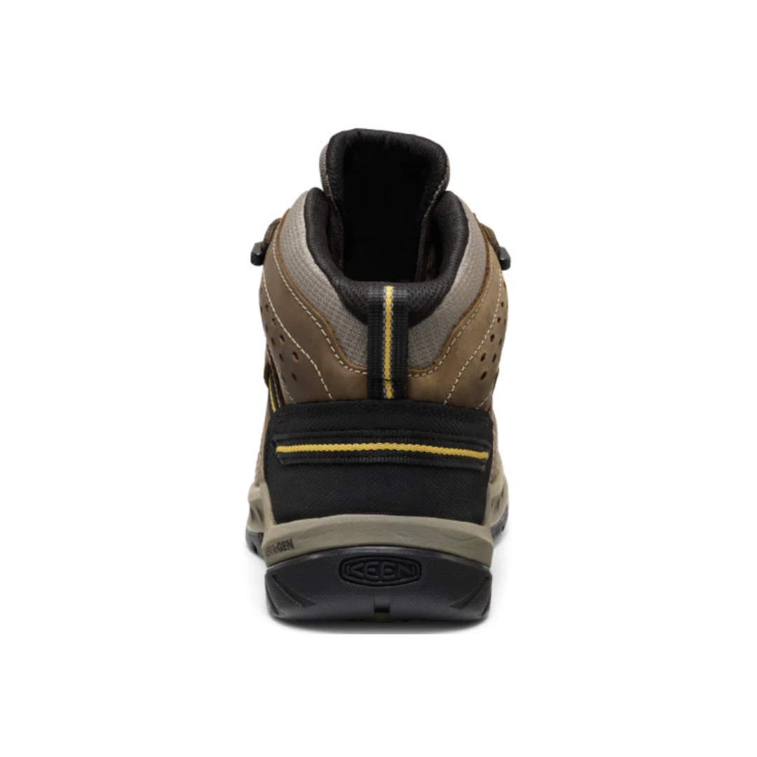 Rear view of the KEEN Men's Flint II Mid Steel Toe Boot in Cascade Brown/Golden Rod highlighting the supportive mid-height collar, external stability shank, cushioned heel, and rugged outsole designed for stability across uneven work surfaces.