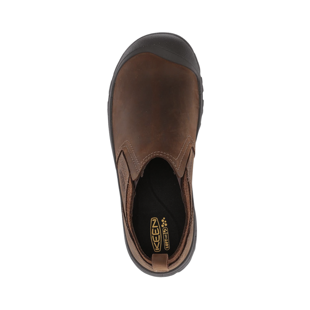 Top view of the KEEN Men's Grayson Slip-On in Mid Brown/Scylum displaying the premium leather upper, stretch-gore panels, breathable lining, and removable insole designed for comfortable extended wear and orthotic compatibility.