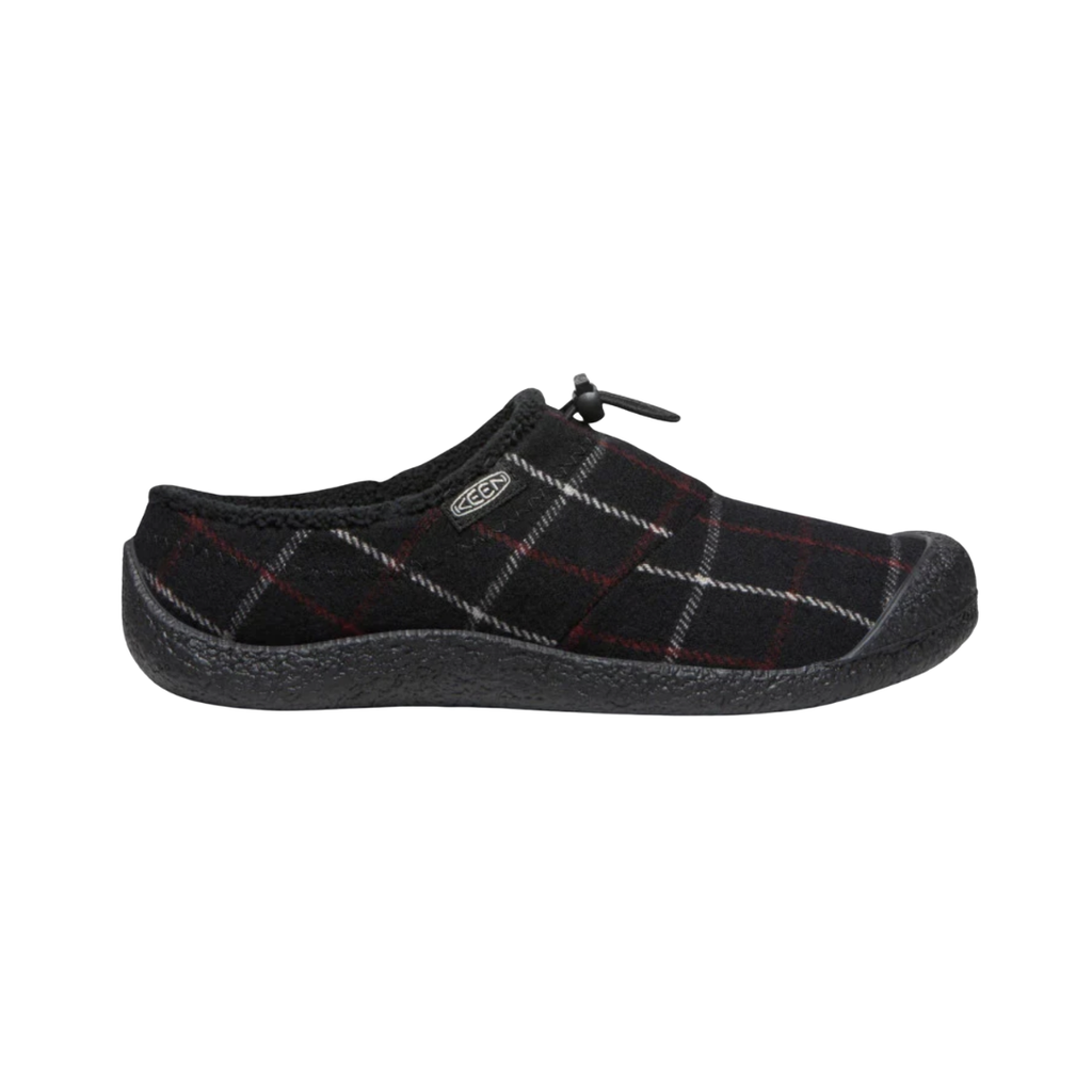 Side view of the KEEN Women's Howser III Slide in Black Plaid, featuring a soft textile upper, slip-on design, stretch gore panels, and non-marking rubber outsole.