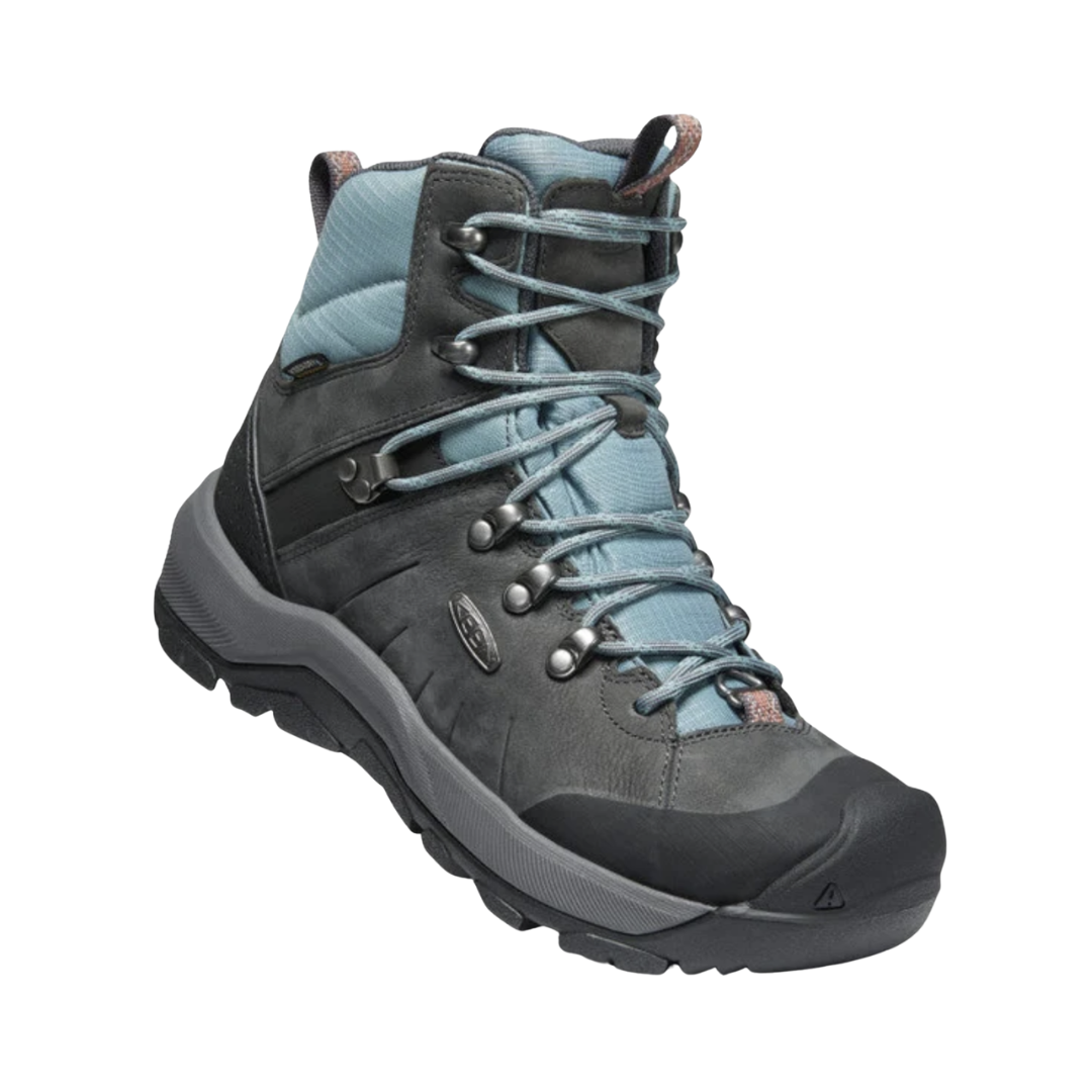 Side view of the KEEN Women's Revel IV Polar Winter Boot in Magnet/North Atlantic, featuring an insulated upper, waterproof construction, dual-density EVA midsole, and rugged rubber outsole.