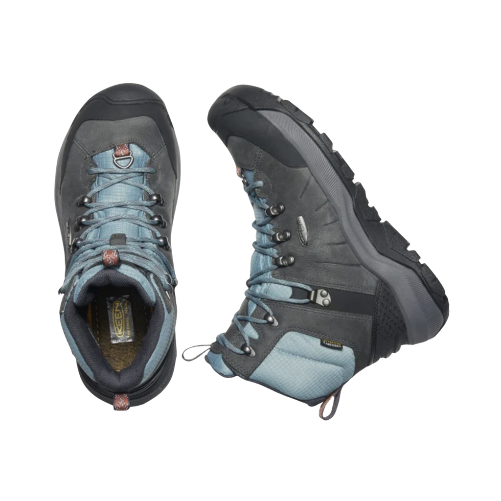 Top view of the KEEN Women's Revel IV Polar Winter Boot in Magnet/North Atlantic, displaying the speed-lace system, metal hooks, padded opening, and removable insole for orthotic-friendly comfort.