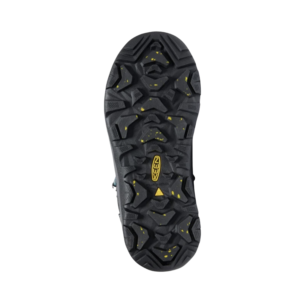 Bottom view of the KEEN Women's Revel IV Polar Winter Boot in Magnet/North Atlantic, featuring an all-terrain rubber outsole with multidirectional lugs for traction on snow, slush, and icy surfaces.