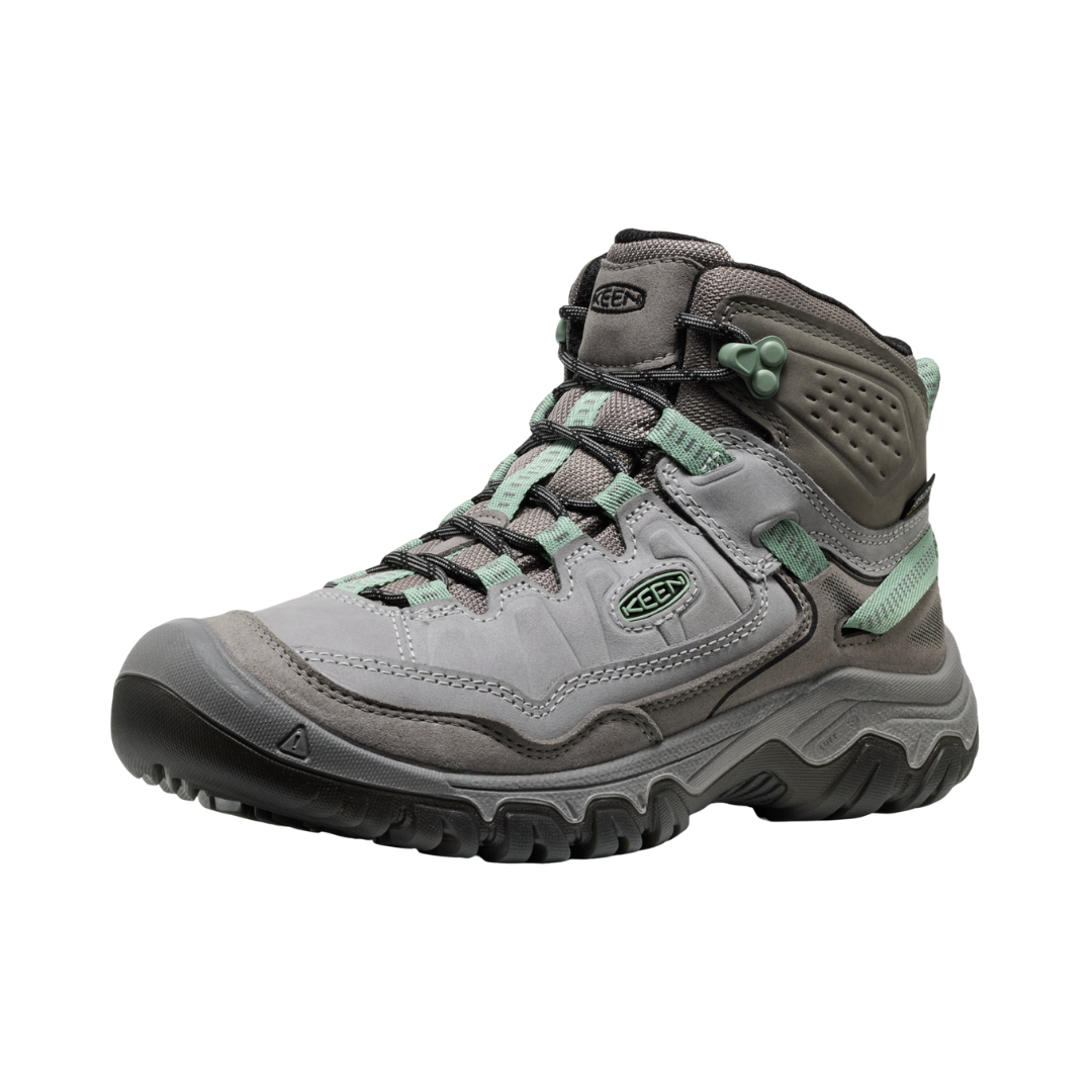 Side view of the KEEN Women's Targhee IV Mid Waterproof Boot in Alloy/Granite Green, featuring a durable environmentally preferred leather upper, cushioned dual-density midsole, and rugged all-terrain rubber outsole.
