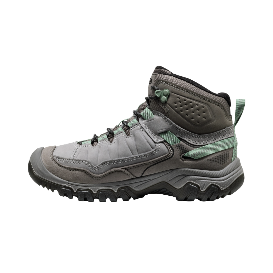Side view of the KEEN Women's Targhee IV Mid Waterproof Boot in Alloy/Granite Green, featuring a durable environmentally preferred leather upper, cushioned dual-density midsole, and rugged all-terrain rubber outsole.