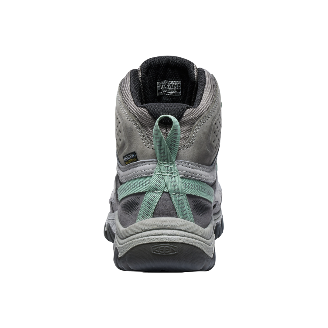 Heel view of the KEEN Women's Targhee IV Mid Waterproof Boot in Alloy/Granite Green, highlighting the supportive heel capture system designed to help reduce heel slippage on uneven terrain.