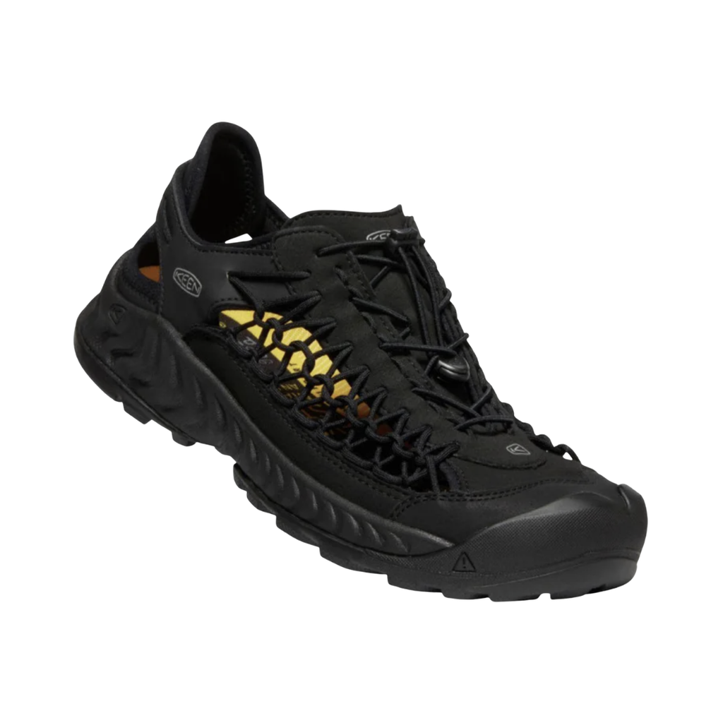 KEEN Men's Uneek NXIS Sandal in Triple Black featuring innovative two-cord construction, a lightweight EVA midsole, and a high-traction rubber outsole for casual outdoor comfort.