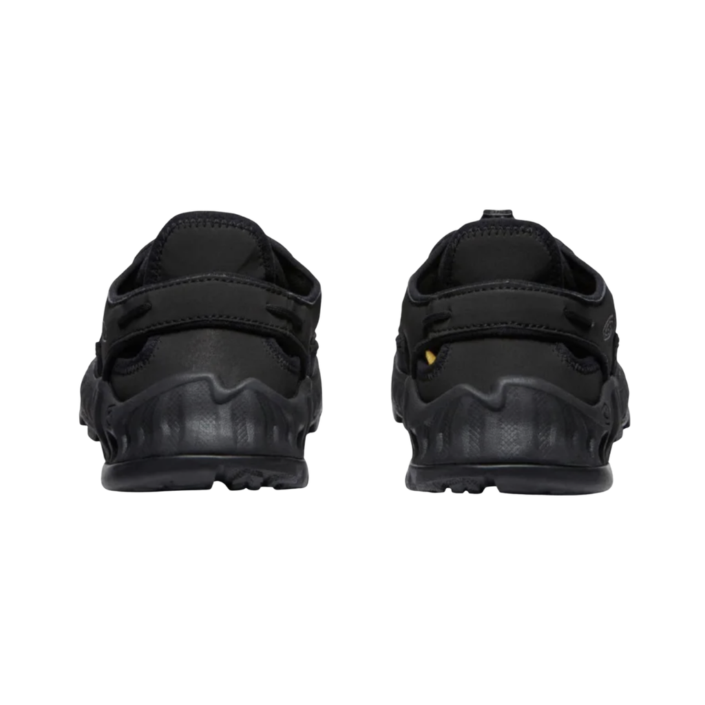 KEEN Men's Uneek NXIS Sandal in Triple Black highlighting the cord-based heel construction and quick-dry lining for breathable comfort in warm weather.
