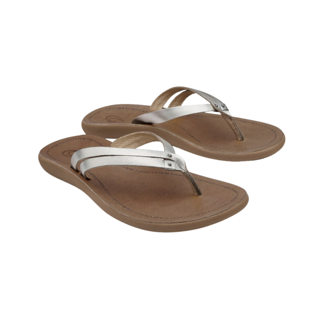 Side view of the Women’s Olukai Kapehe Luana in Silver/Sahara, highlighting the premium full-grain leather straps, anatomically contoured footbed, and lightweight, flexible design.
