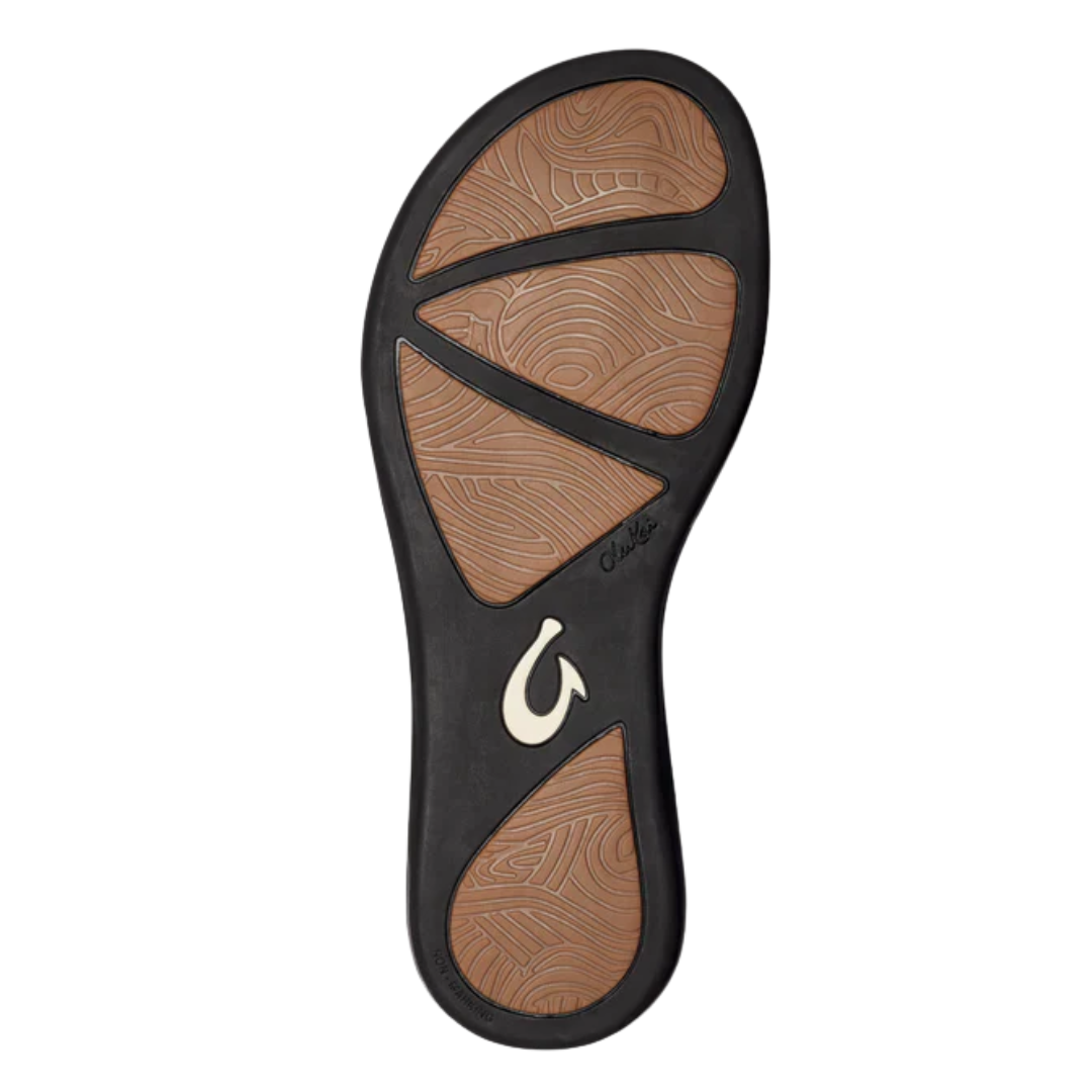 Bottom view of the Women’s Olukai ‘Aukai in Dark Java, featuring the durable non-marking rubber outsole engineered for traction on various surfaces.