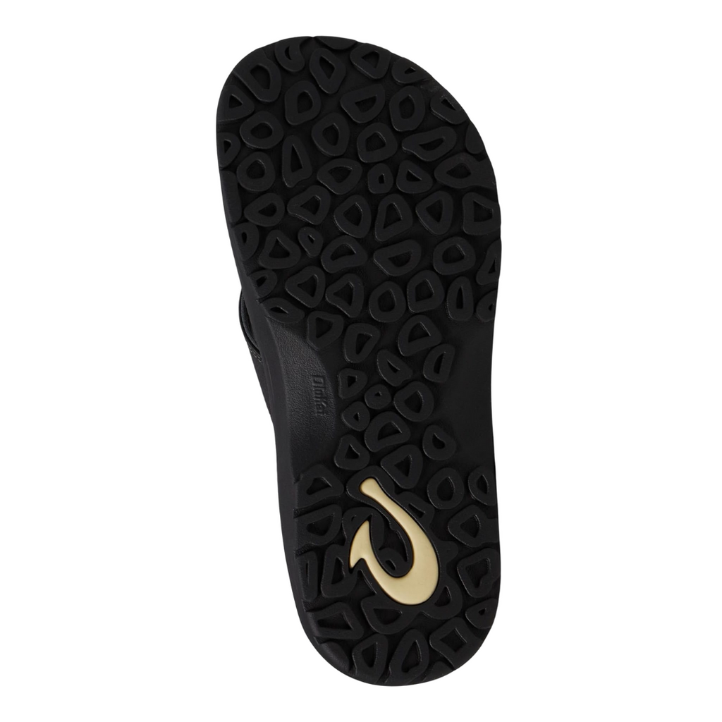 Bottom view of the Men’s Olukai ʻOhana in Black/Dark Shadow, showing the textured rubber outsole engineered for traction on wet or dry surfaces.