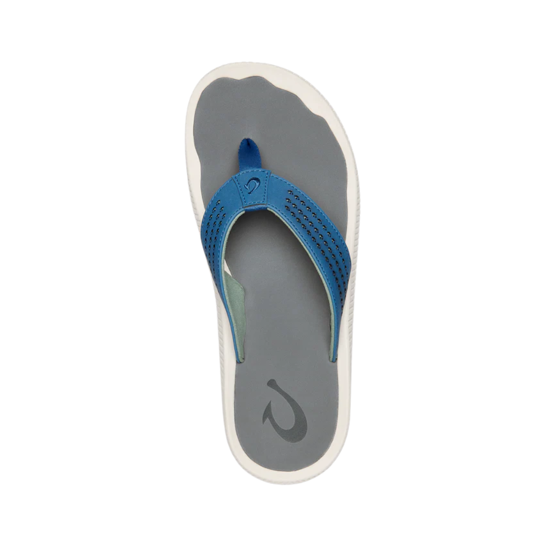 Top view of the Men’s Olukai Ulele in Slate Blue/Charcoal, displaying the laser-etched footbed texture, anatomical contours, and quick-drying strap design.