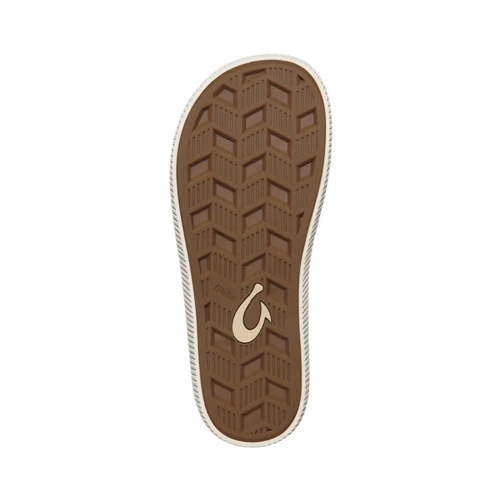 Bottom view of the Men’s Olukai Ulele in Slate Blue/Charcoal, showing the textured rubber outsole engineered for traction on wet or slippery surfaces.
