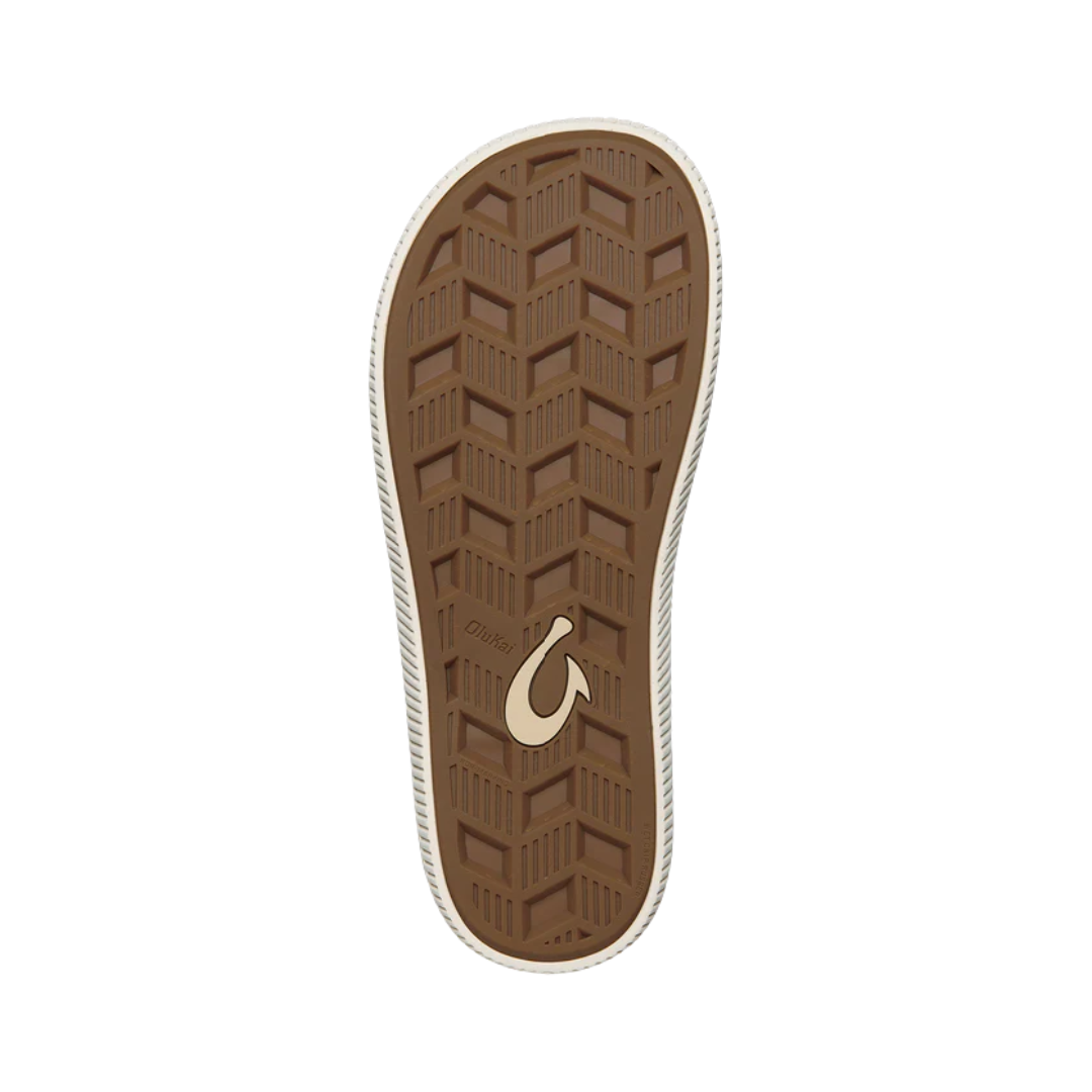 Bottom view of the Men’s Olukai Ulele in Slate Blue/Charcoal, showing the textured rubber outsole engineered for traction on wet or slippery surfaces.