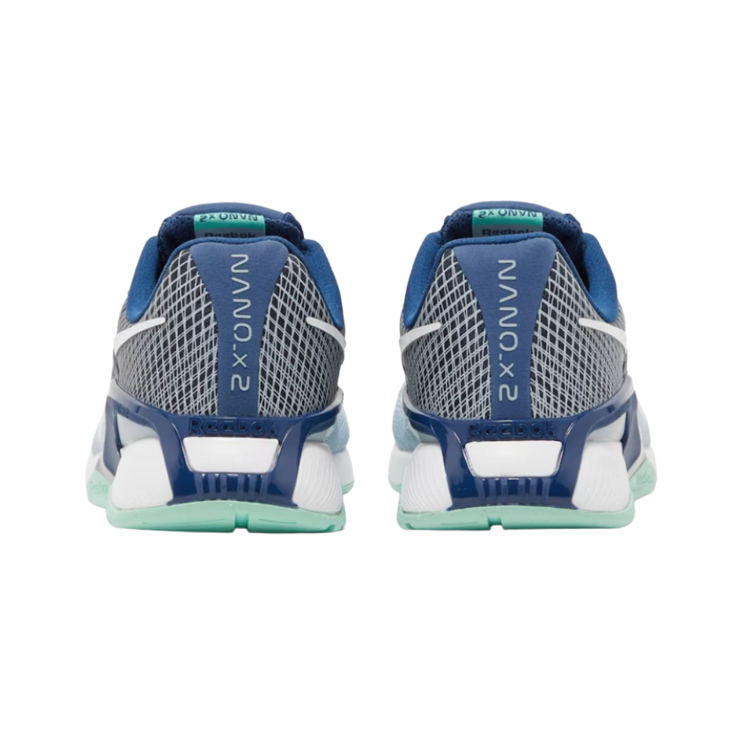 Heel view of the Women’s Reebok Nano X2 in Gable Grey/Batik Blue/Hint Mint, featuring the reinforced heel clip for added stability during lifts and high-intensity workouts.